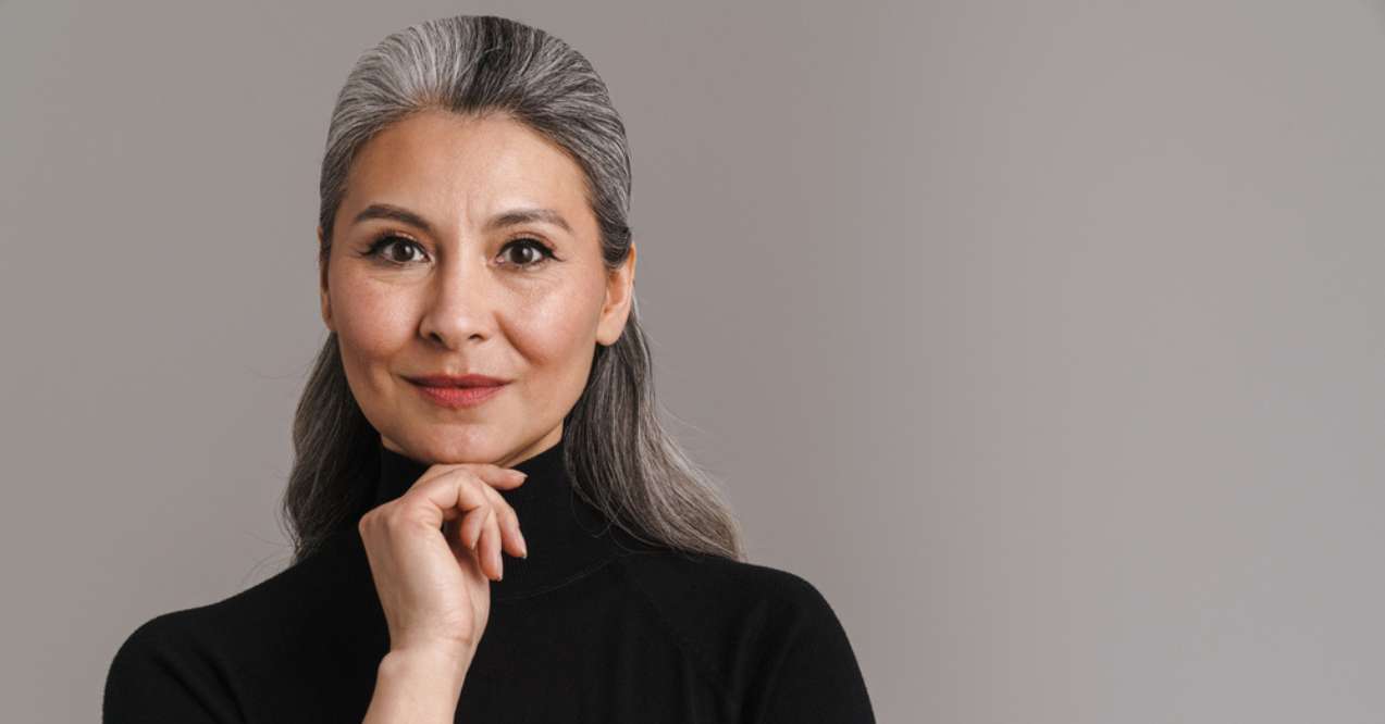 Portrait of a confident mature Asian woman with gray hair