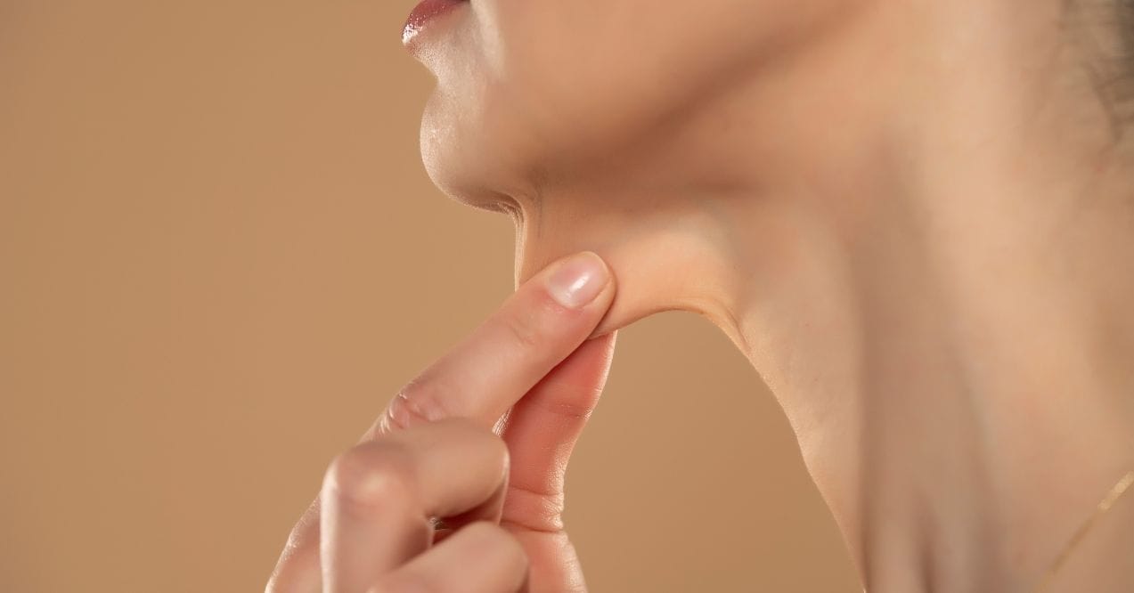 Hand pinching loose neck skin