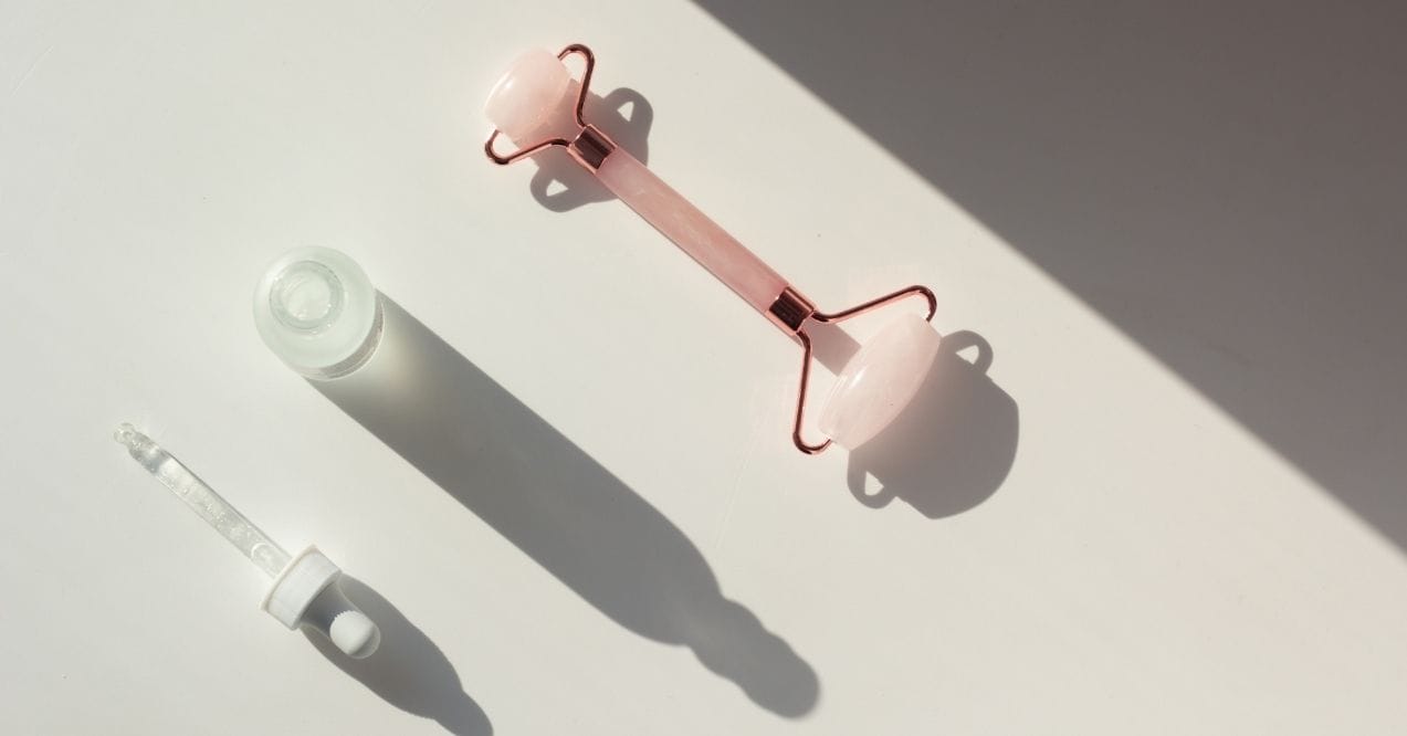 Skinimalism-inspired skincare tools: roller and dropper bottle