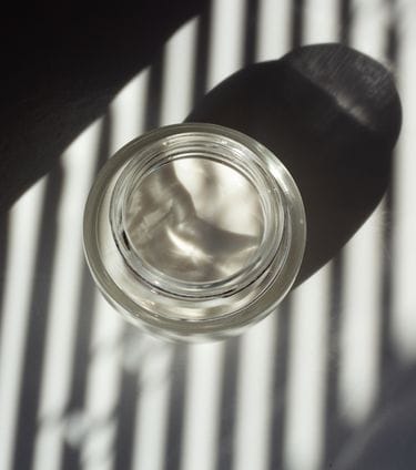 Minimalistic glass jar with soft shadows
