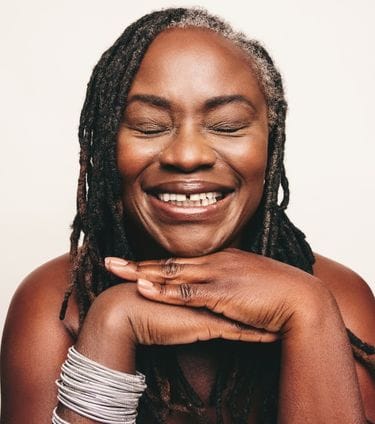 Smiling woman with smooth, youthful skin