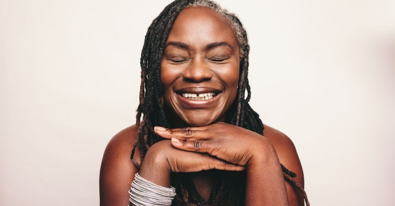Smiling woman with smooth, youthful skin